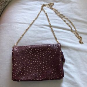 Maroon and gold clutch with gold chain